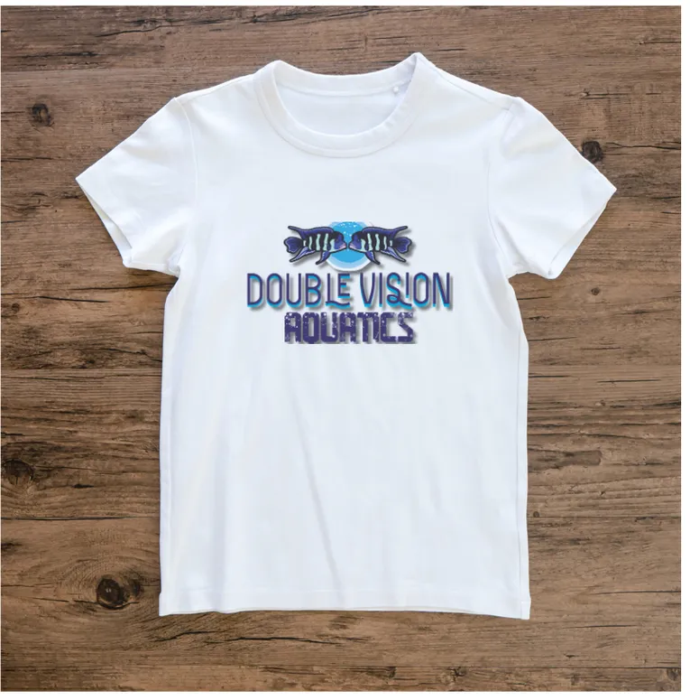 White Double Vision Aquatics t-shirt with the two-cichlid logo design, laid flat on a wood background