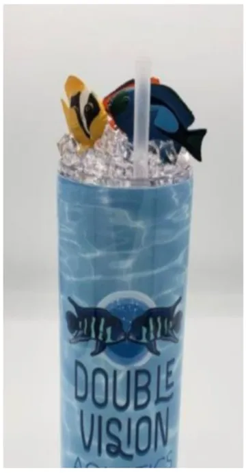 Oceanview tumbler — rippling pool-blue water wrap with the DVA logo, straw, and reef fish on the lid